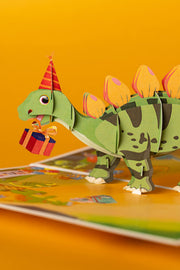 DINOZAURIUKAI SVEIKINA SU GIMTADIENIU: išskirtinio grožio 3D pop - up atvirukas + vokas - OBUOLYS